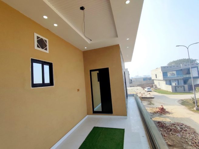 5 marla Brand New House For Sale In Model City 1 faisalabad having 3bedrooms 2Tv lounge 2kitchen drawing room carporch ideal location demand 1,80,00,000.